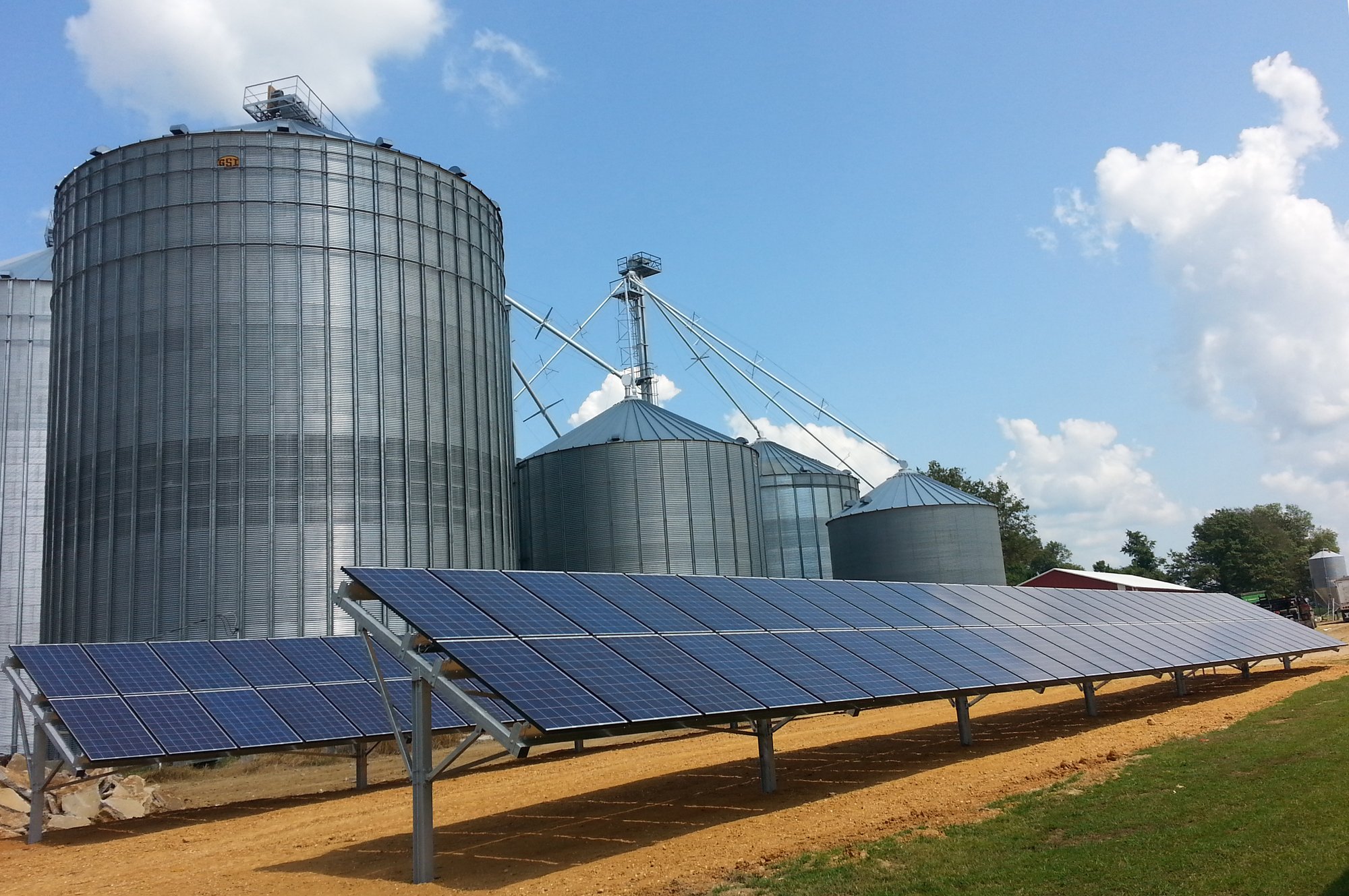 Solar panels next to silos in Illinois.
